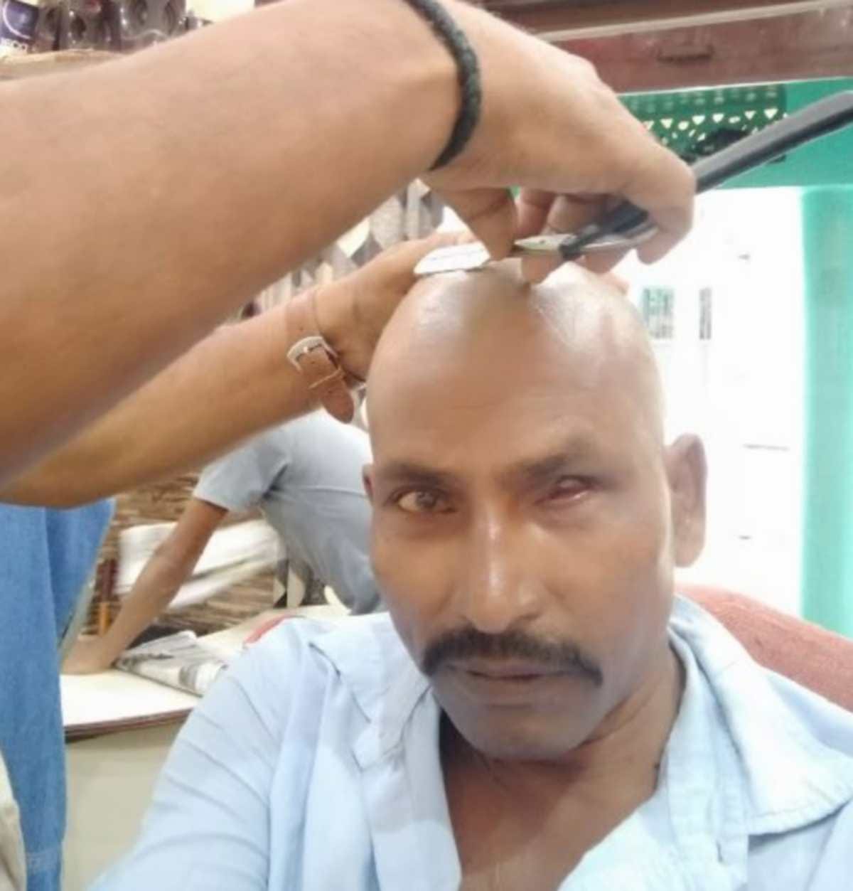 Shiv Sena district president shaved against police harassment Shiv Sainiks protest in Chandauli