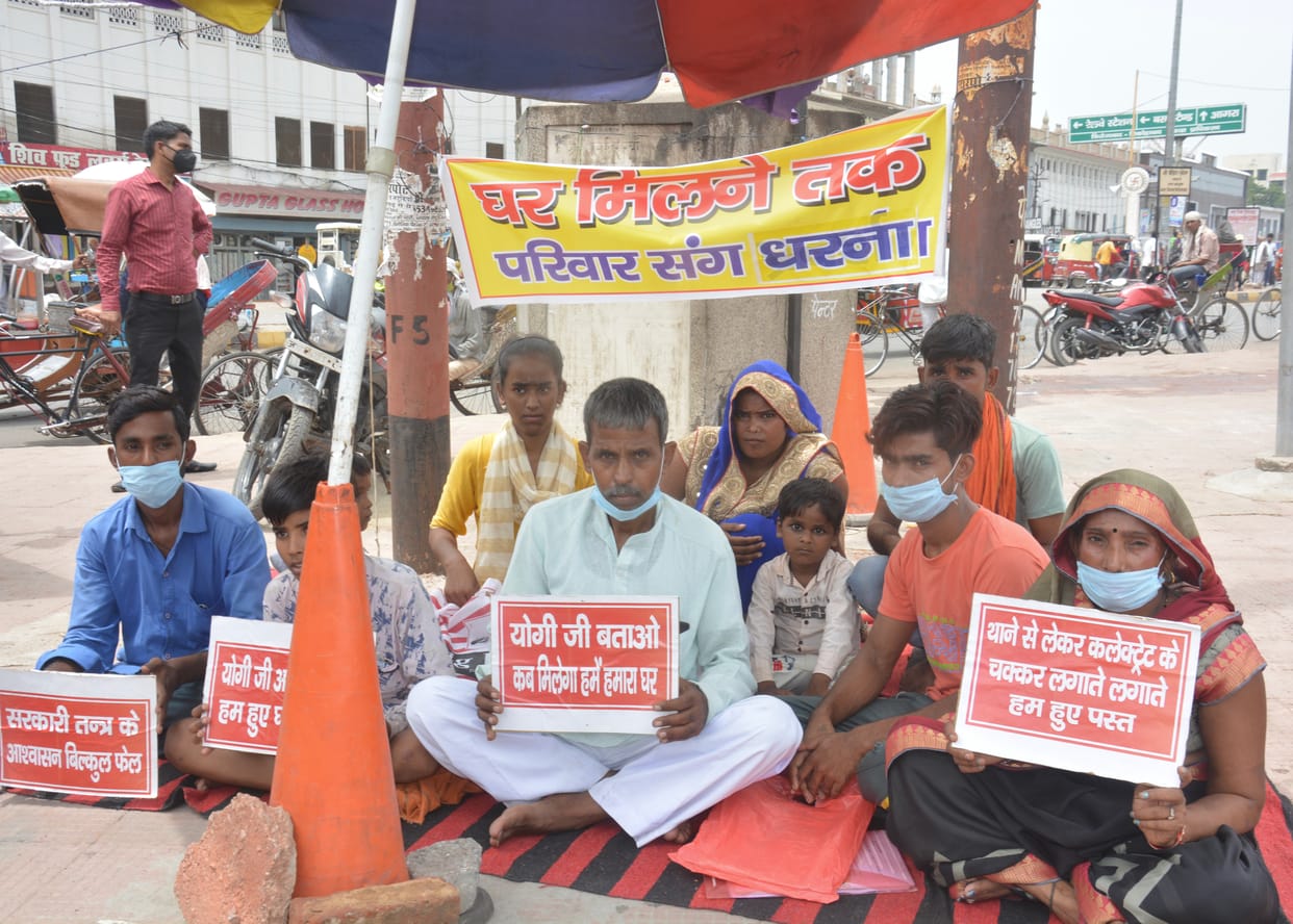 Victim sitting on dharna along with family to vacate the house
