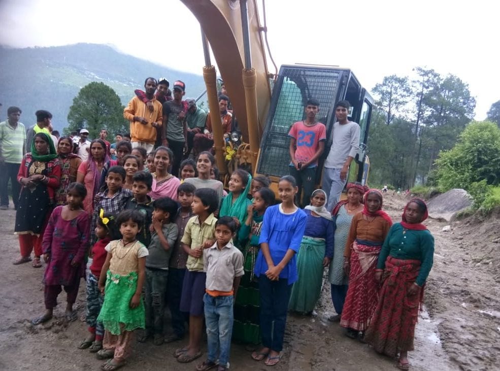 Villagers jump with joy on reaching the road in Kothar village