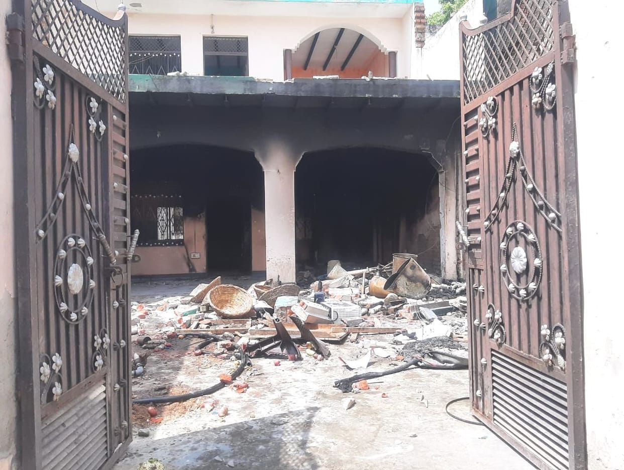 The houses of two killers were vandalized and set on fire.