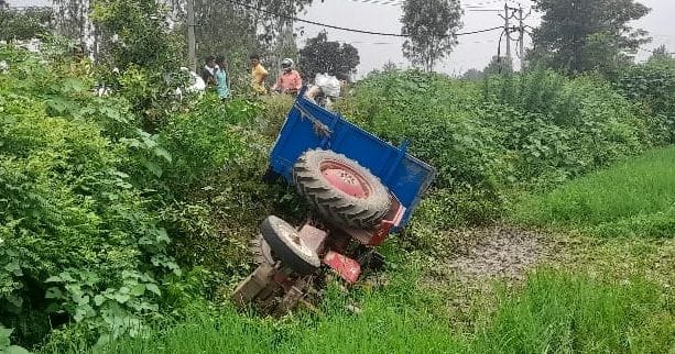 Tractor overturned in the field due to tire burst