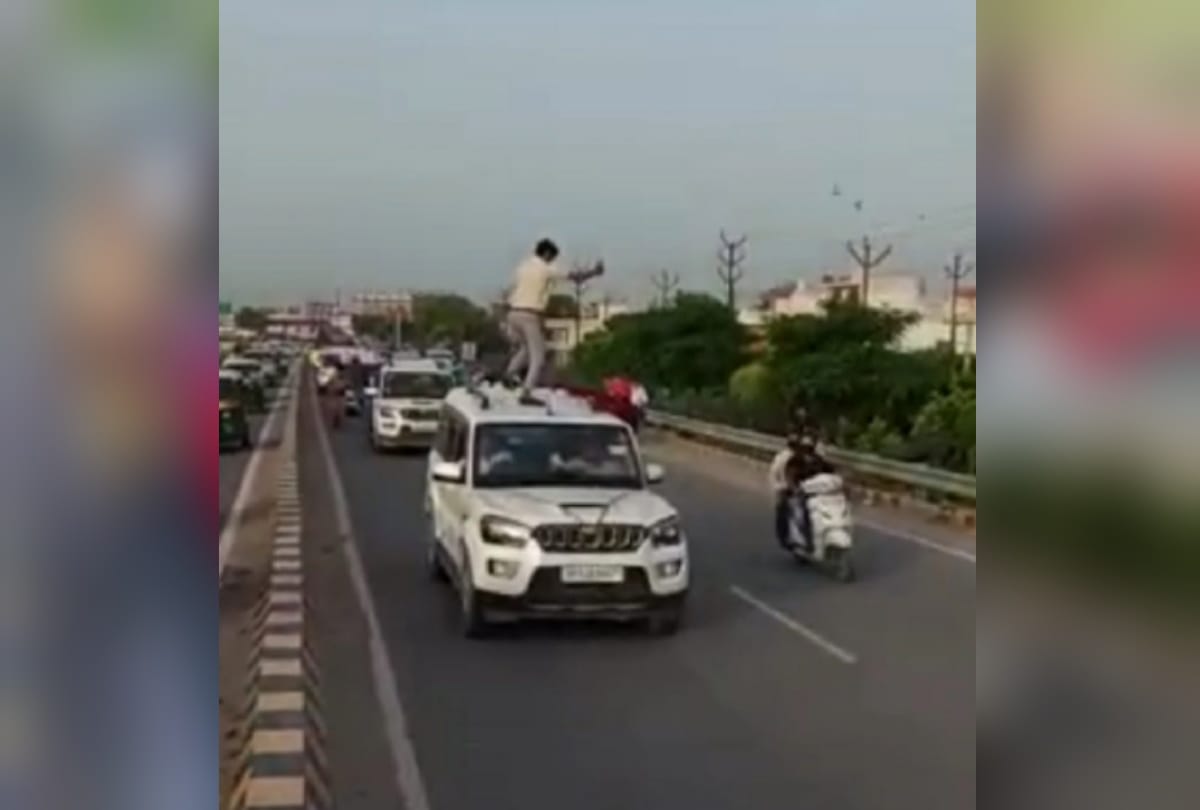 Ghaziabad loni mla nand kishor gurjar sat in Mercedes without number plate in his convoy many stand on car making video