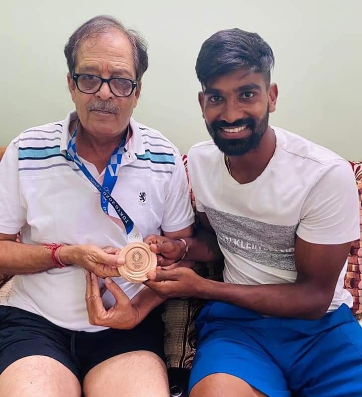 Bronze medalist Sumit presented a medal to his former coach
