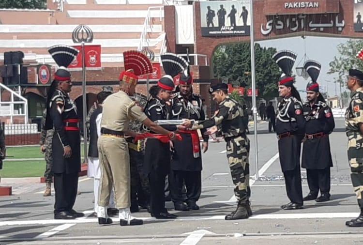 Pakistan Rangers and Border Security Force exchange sweets at Attari border on Independence Day of Pakistan