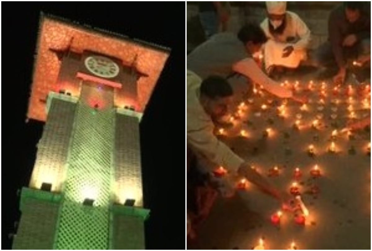 people lighting diyas near Ghanta Ghar at Lal Chowk in Srinagar on 75th Independence Day