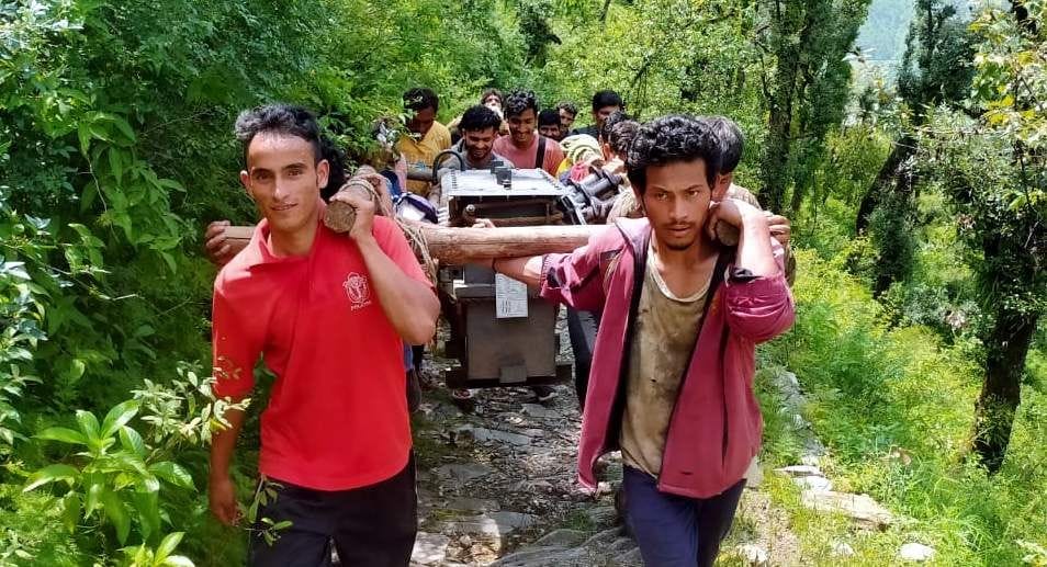 Villagers carried the transformer on their shoulders and carried them to the village