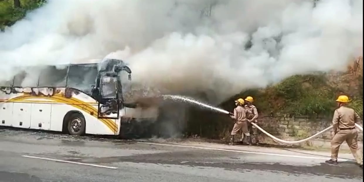 Fire in a Volvo bus parked on Kullu-Manali NH, The fire started from the bus started moving towards the forest, the firefighters got it under control.