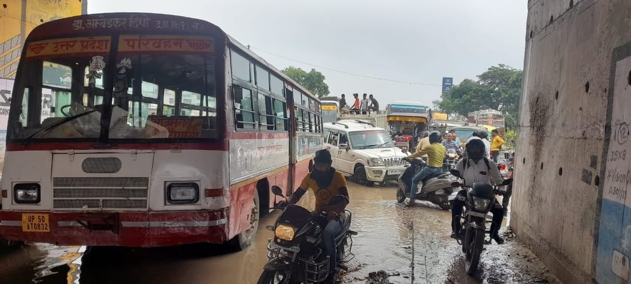 Vehicles damaged under the underpass, long jam