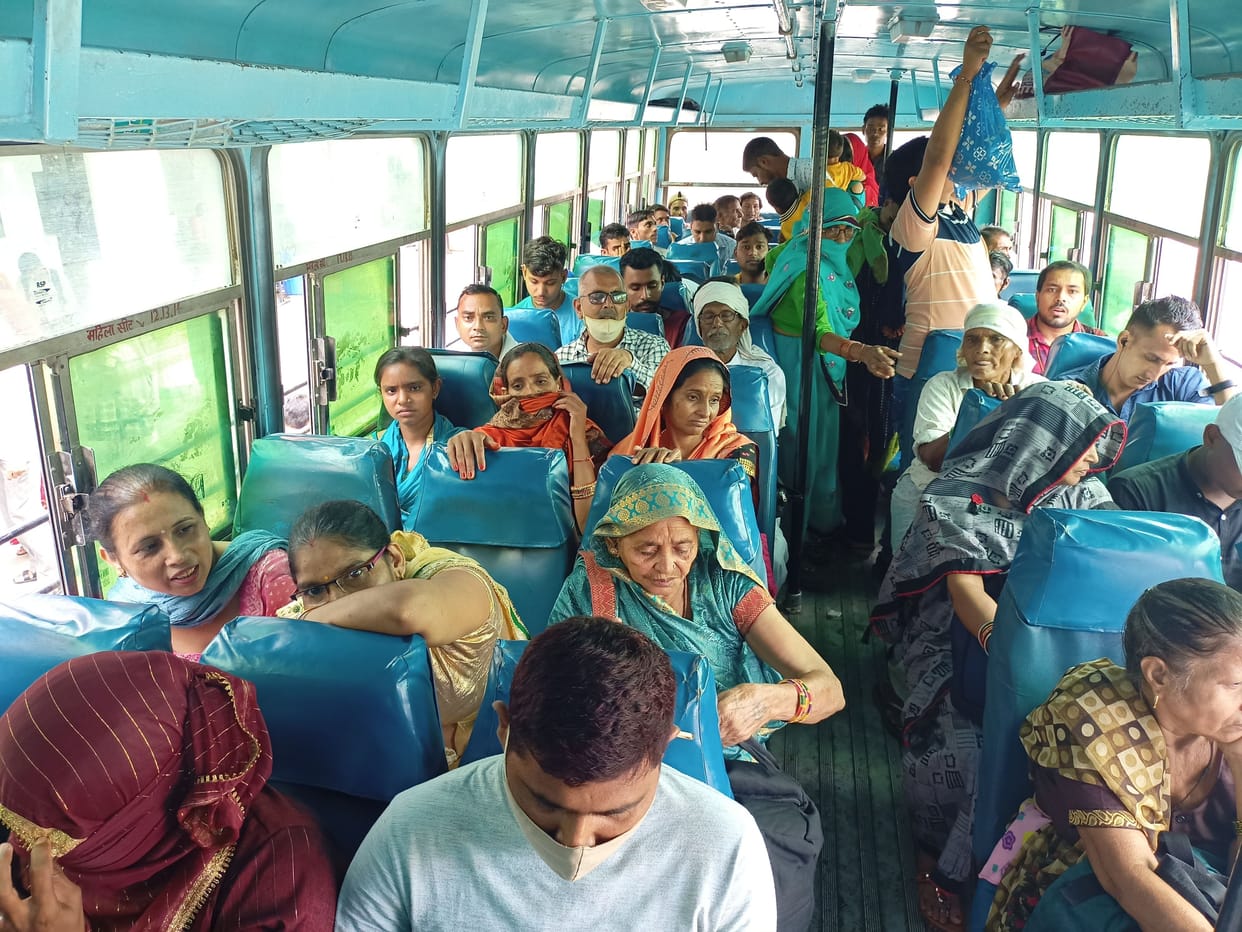 Crowd of women gathered for free travel in buses