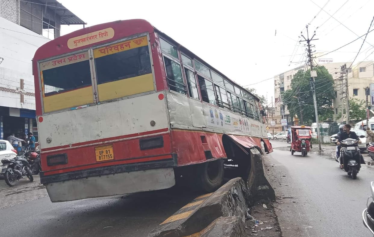UP Roadways bus climbed on the divider