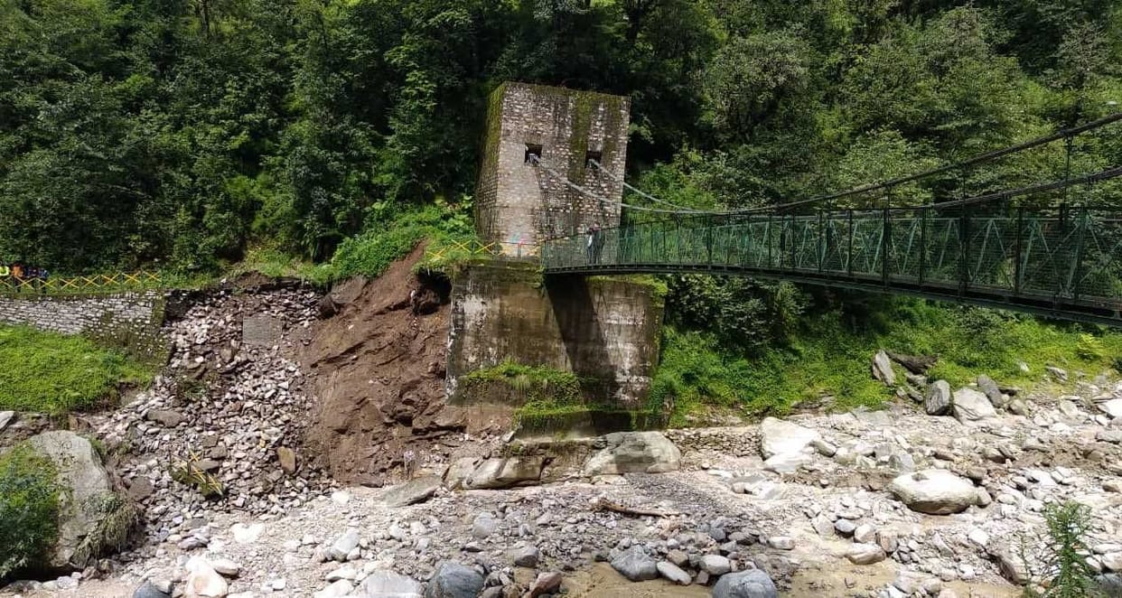 The foot bridge built on the trekking route came under threat due to rain