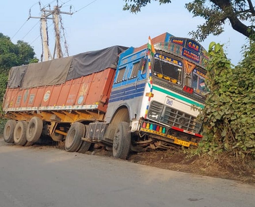 Gravel was uprooted in the rain, again the pits in the highway