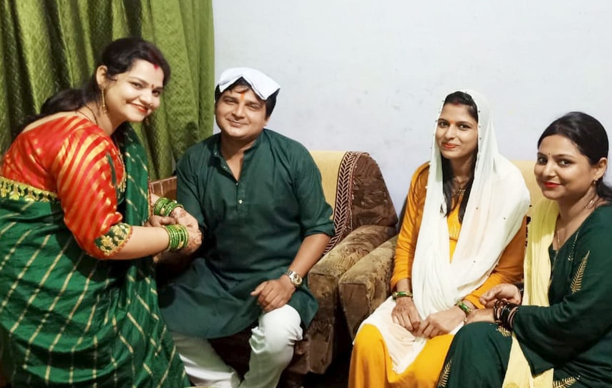 Sisters wish long life by tying a rakshasutra to their brother