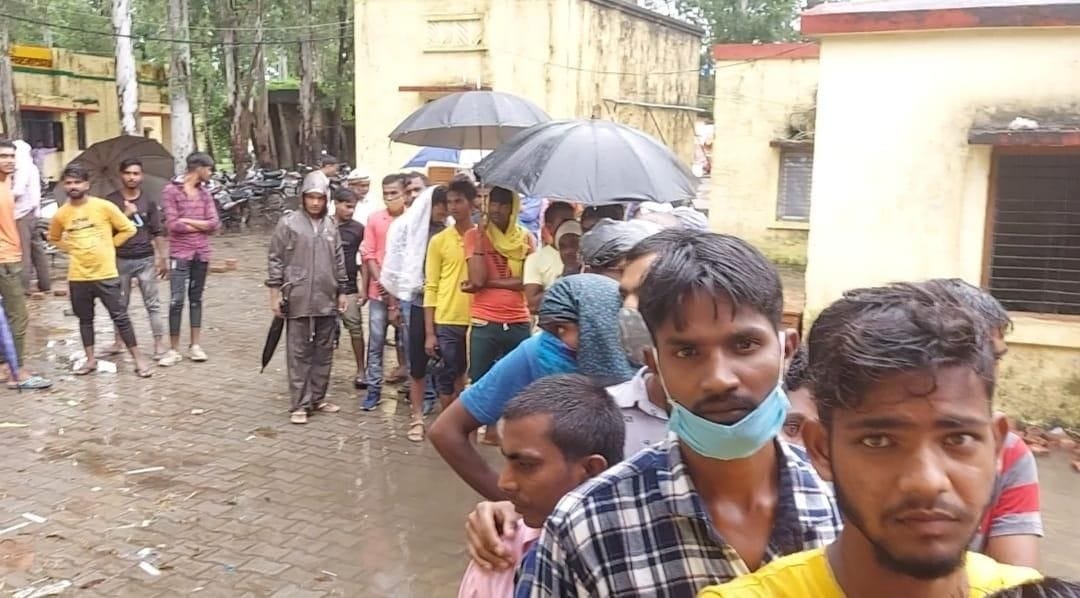 people who came to get vaccinated with umbrella