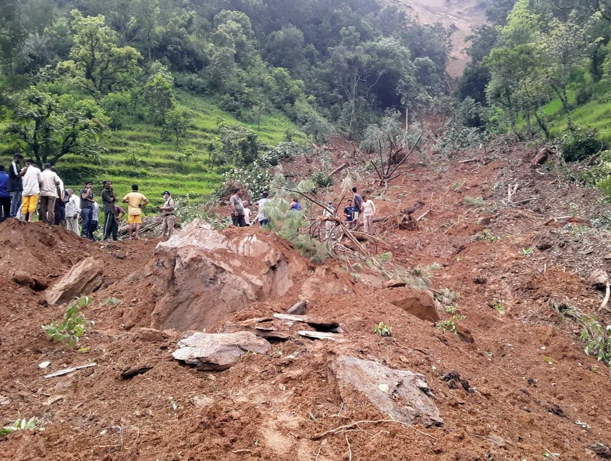 Woman washing clothes buried under rubble, search continues
