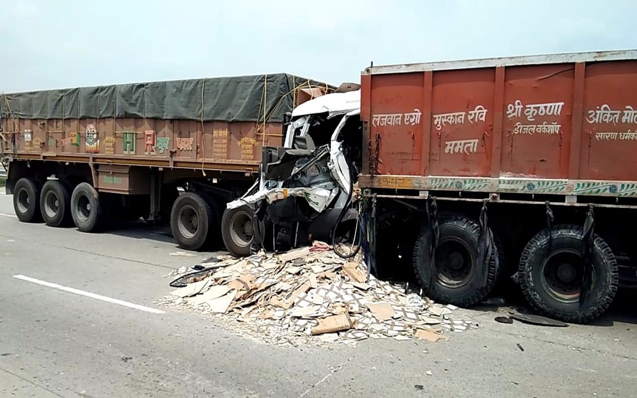 over speed container collided with truck parked on highway in varanasi road accident two people died including  driver