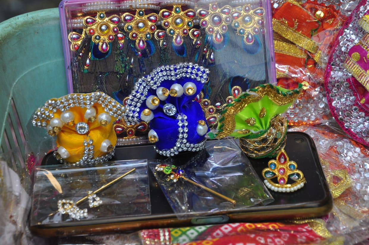 Kanha is seated with the cow mother in the form of Bal-Gopal.