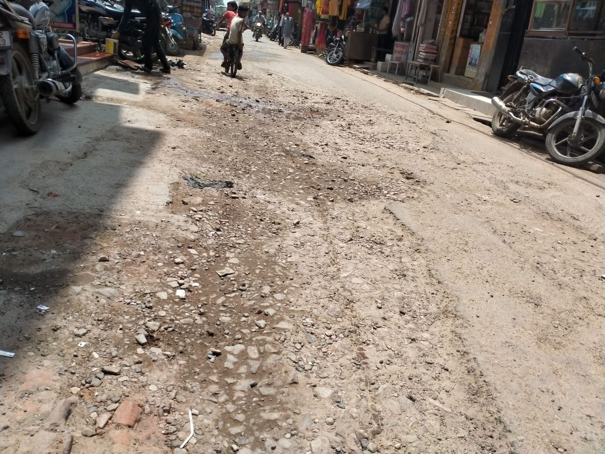 Shopkeeper upset due to dilapidated road