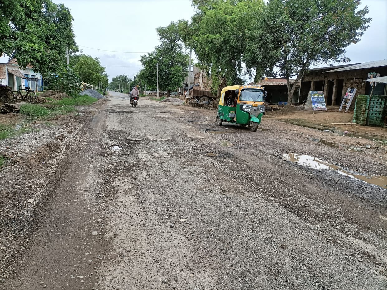 roads patchwork destroid in rain