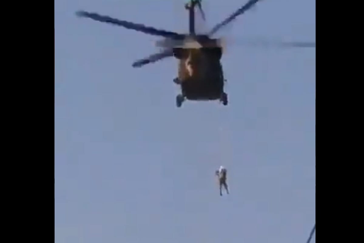 Taliban hangs a man who helped America to death and carried his dead body all over the city in Afghanistan claims a video news in Dindi