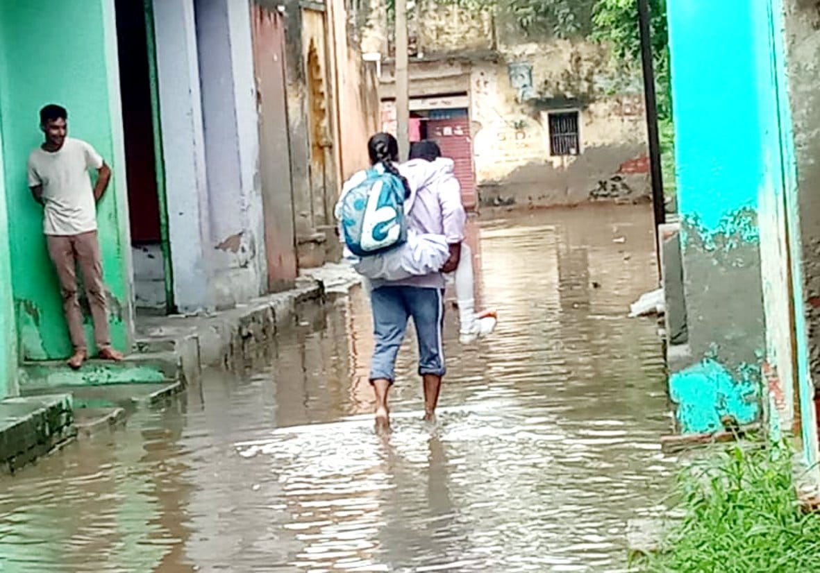 Pond overflow, two feet of water filled in houses and streets