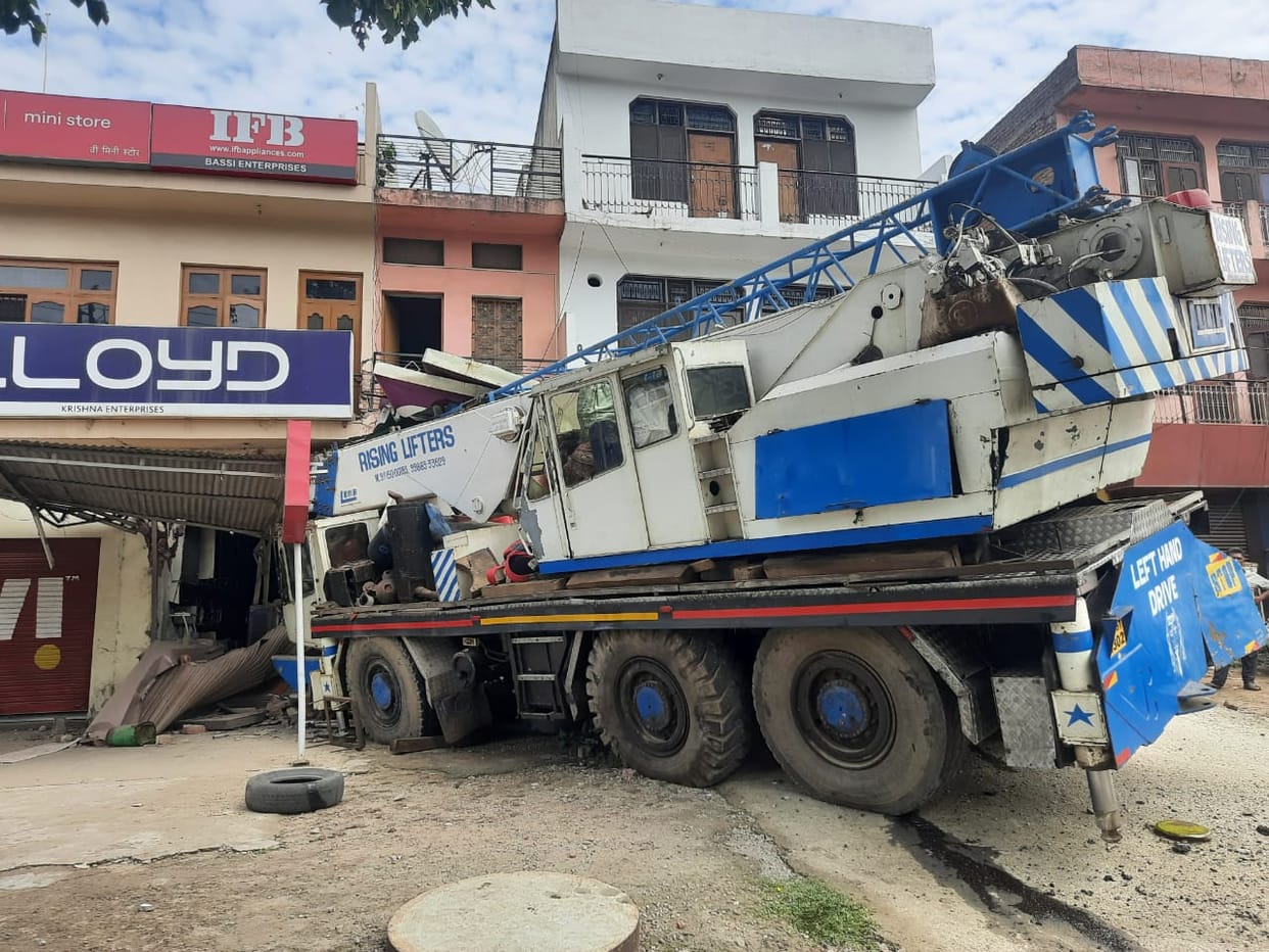 Uncontrolled craine hits two shops and one ATM on Nalagarh bipass