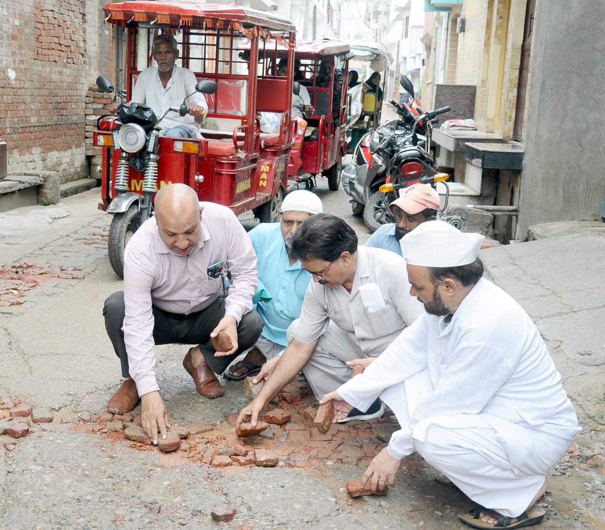 Local people filled the potholes of the roads by pouring bricks and sand