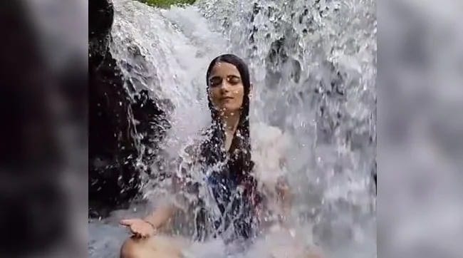 viral video actress radhika madan meditation under waterfall
