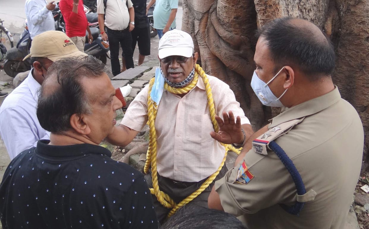 Opposed to cutting a tree by tying a rope around the neck