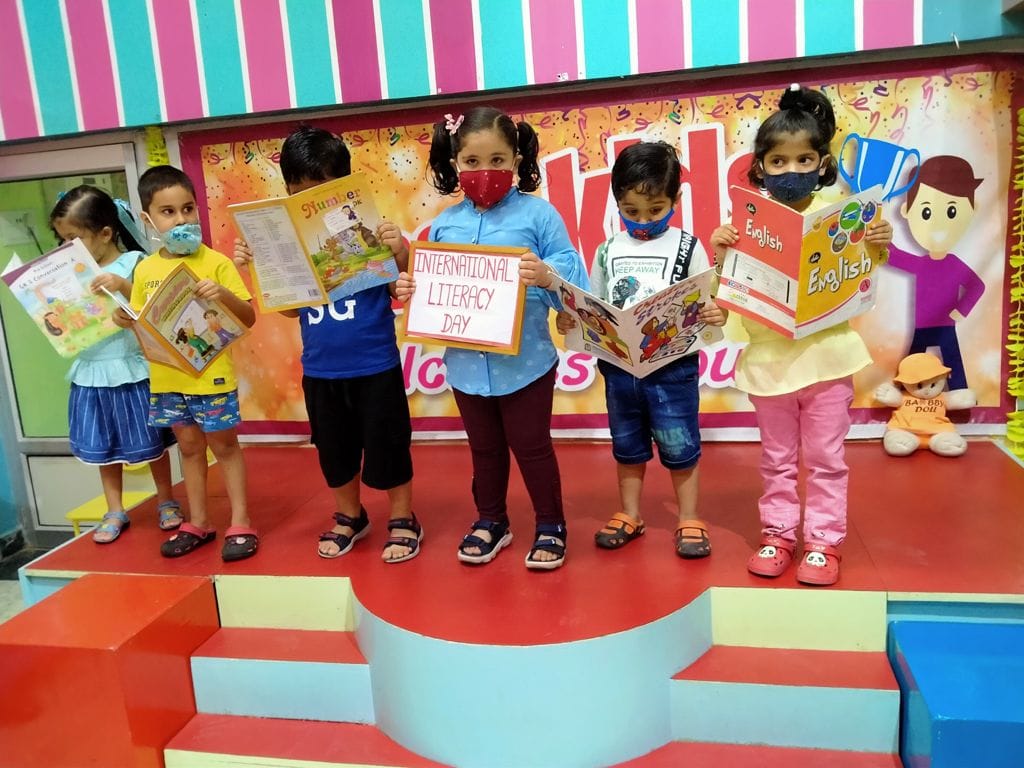 'Development of society and nation through literacy'