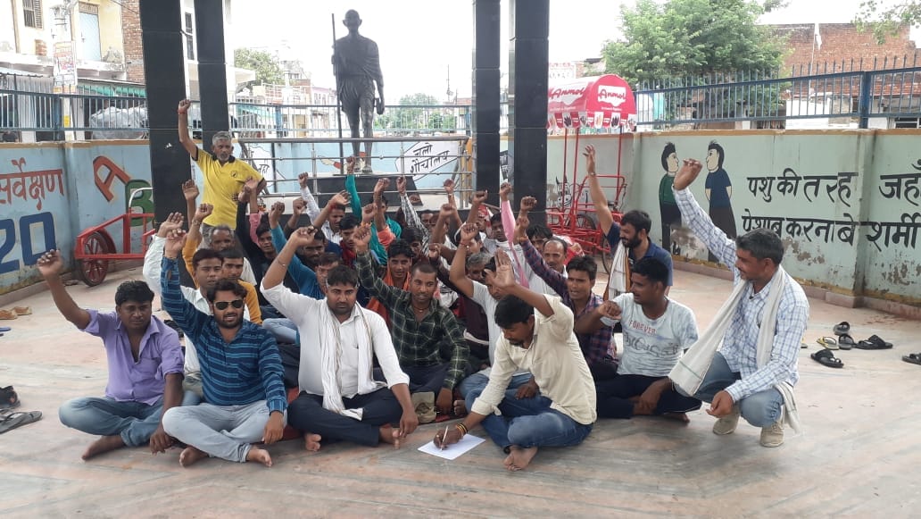 The contract workers of the Electricity Department staged a sit-in