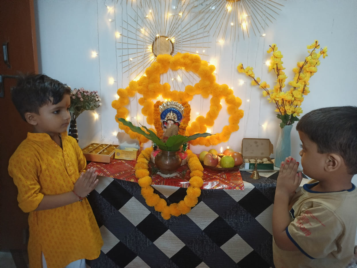 Gajanan sits in the pandals, people immersed in devotion