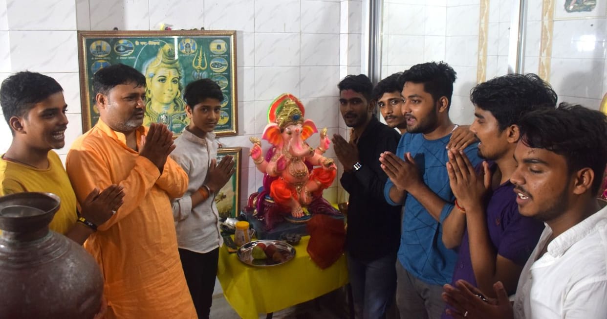 Ganesh pandal decorated, Gajanan seated amidst Vedic chants