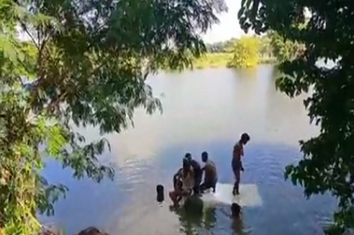 van carrying school children overturns falls into river in  Begusarai
