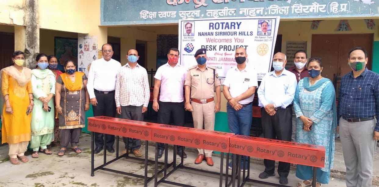 rotary donate 24 desk to school