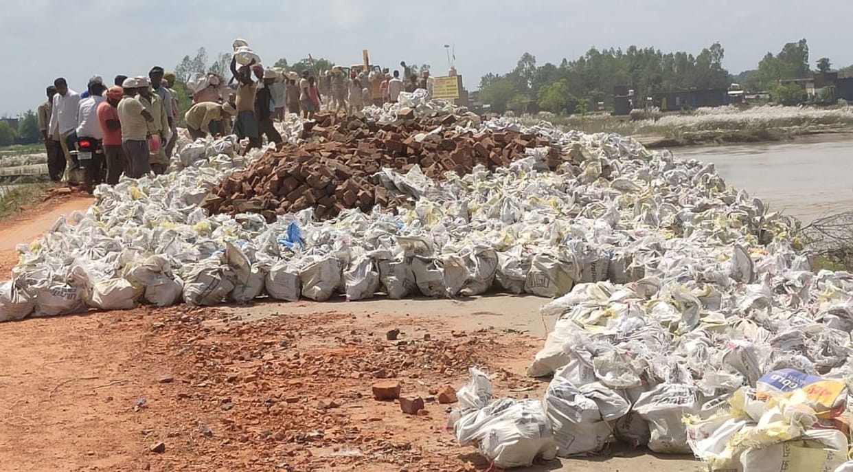 Rapti's wave is swallowing up trees, sacks of bricks