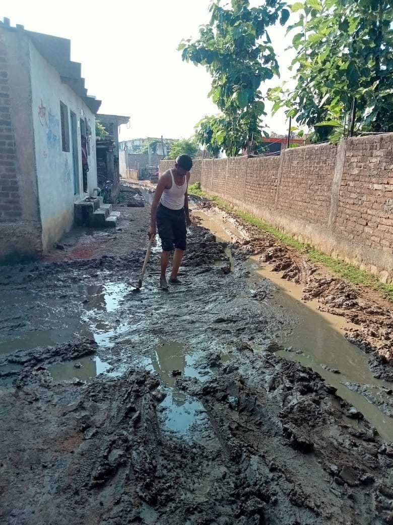 mud filled road, people crisis