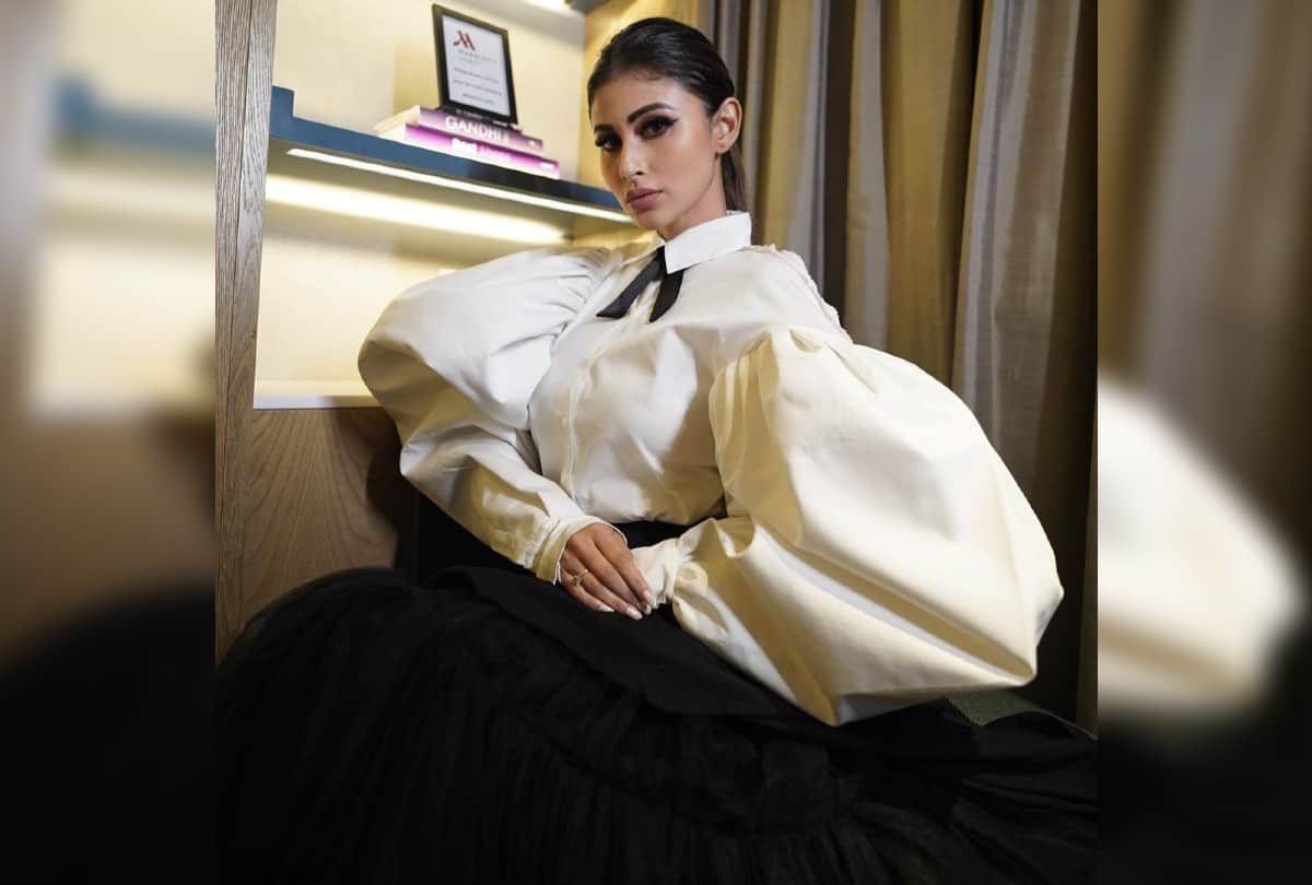 Stylish Look Of Mouni Roy Carrying Wolf Wing White Shirt With Black Skirt