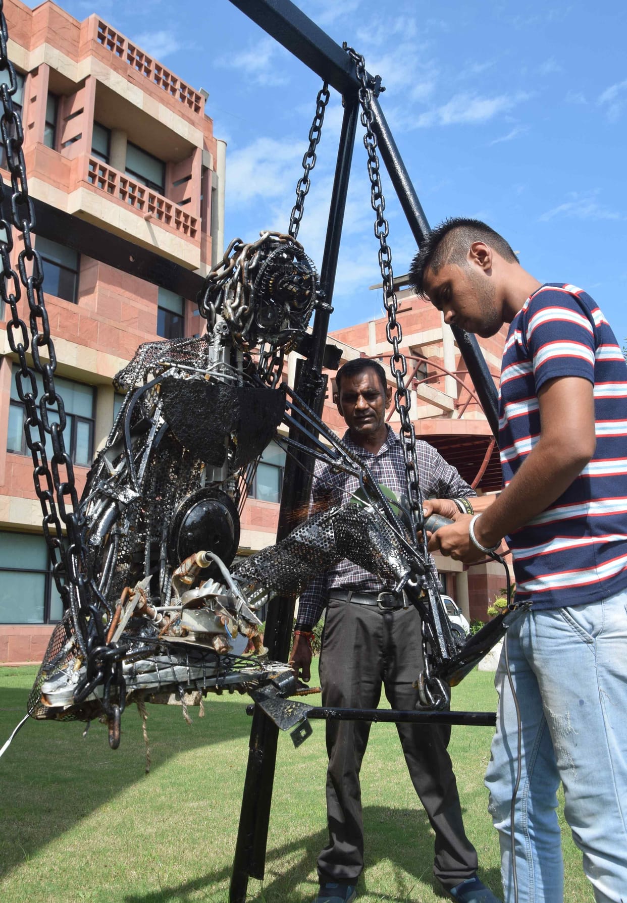 An effigy of an elderly farmer made by storing waste iron
