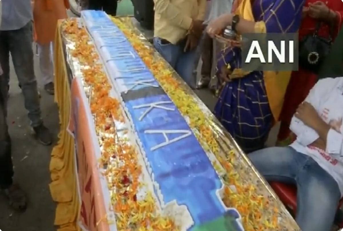 Madhya Pradesh BJP workers cut a 71-feet-long vaccine shaped cake on the eve of the 71st birthday of PM Narendra Modi