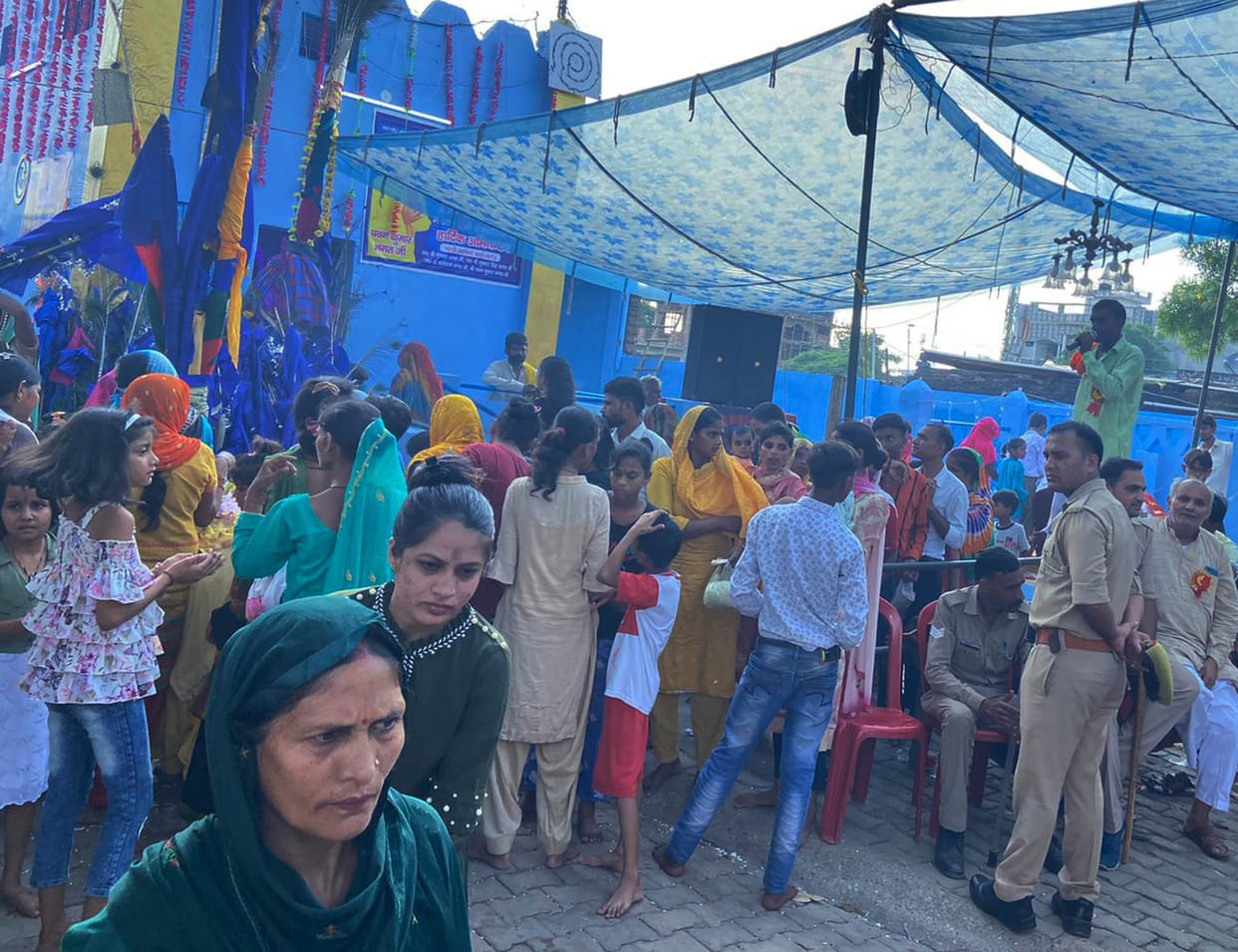 Devotees put marks on the ancient Goga Mhadi