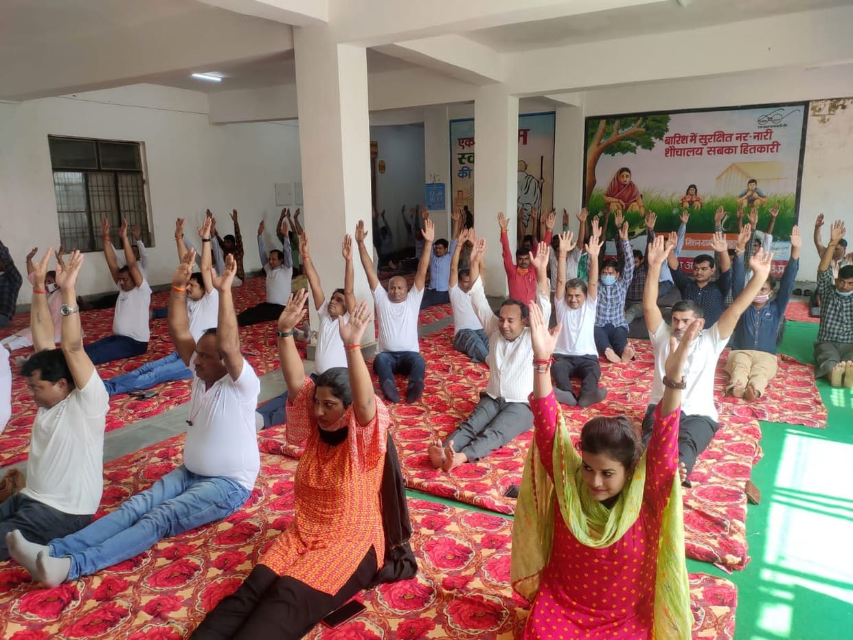 Officer-employee keep body fit with yoga