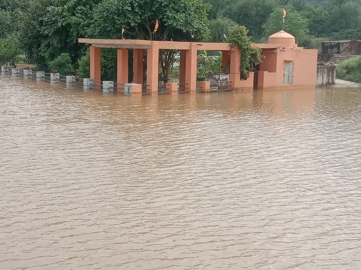 Ancient temple submerged in rain, danger of breaking johad
