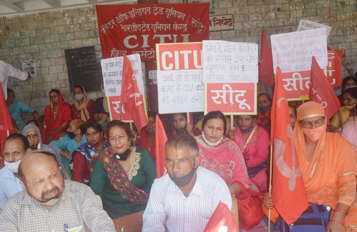 Anganwadi and mid day meal workers staged a sit-in protest at Gandhi Chowk