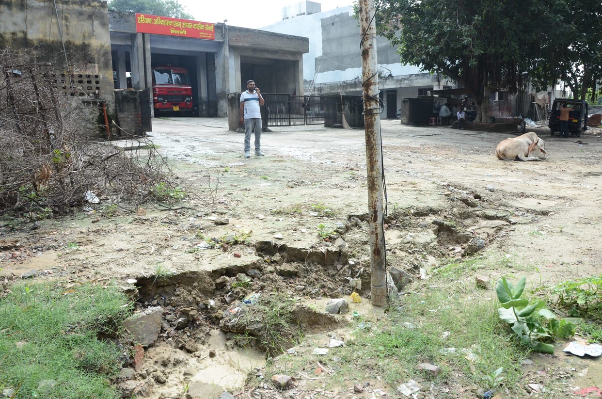 Pavement sunk in the rain, no way left even for fire brigede