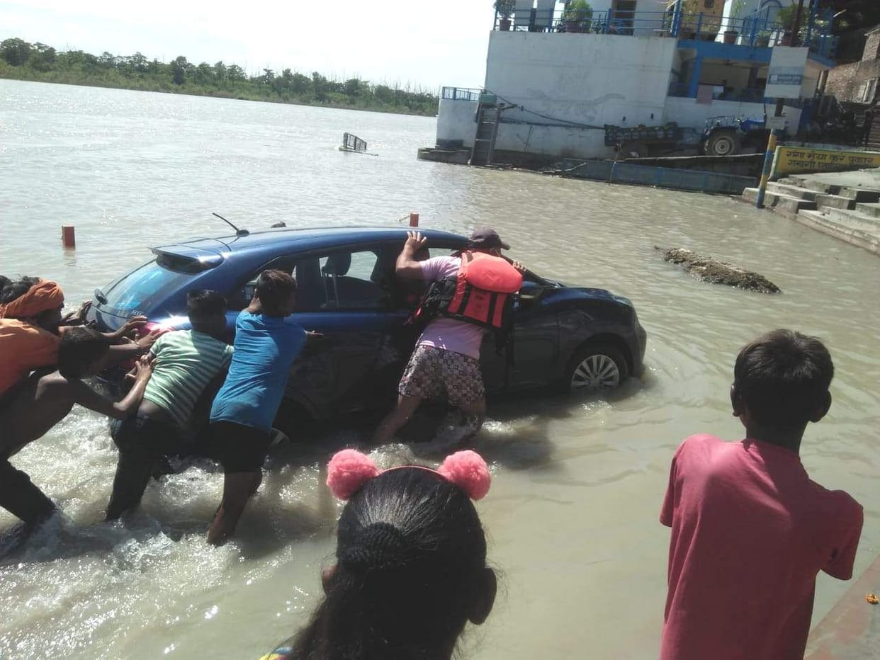 The car was swept away in the Ganges at Triveni Ghat.