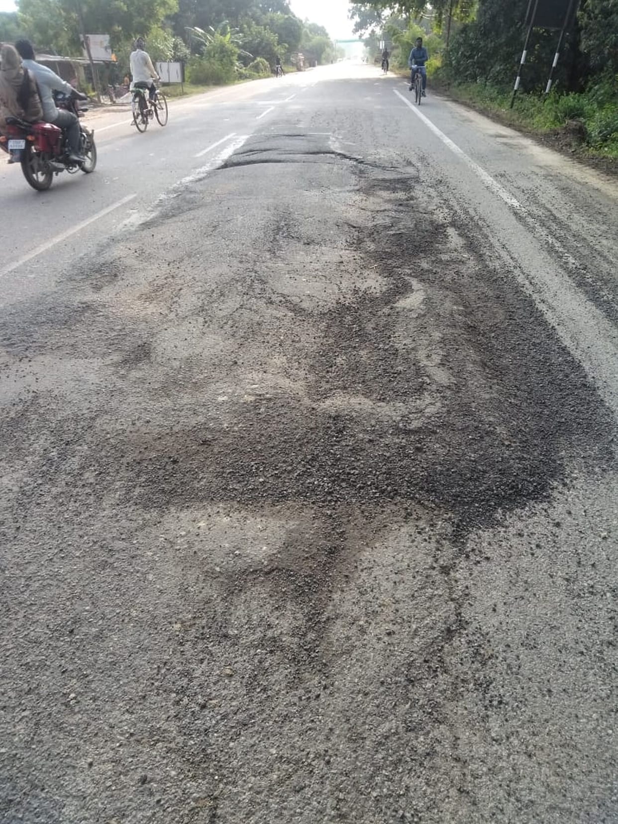 Passengers eating potholes on the National Highway