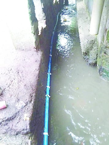 The power cable was removed from the drain but the camera cable is still there