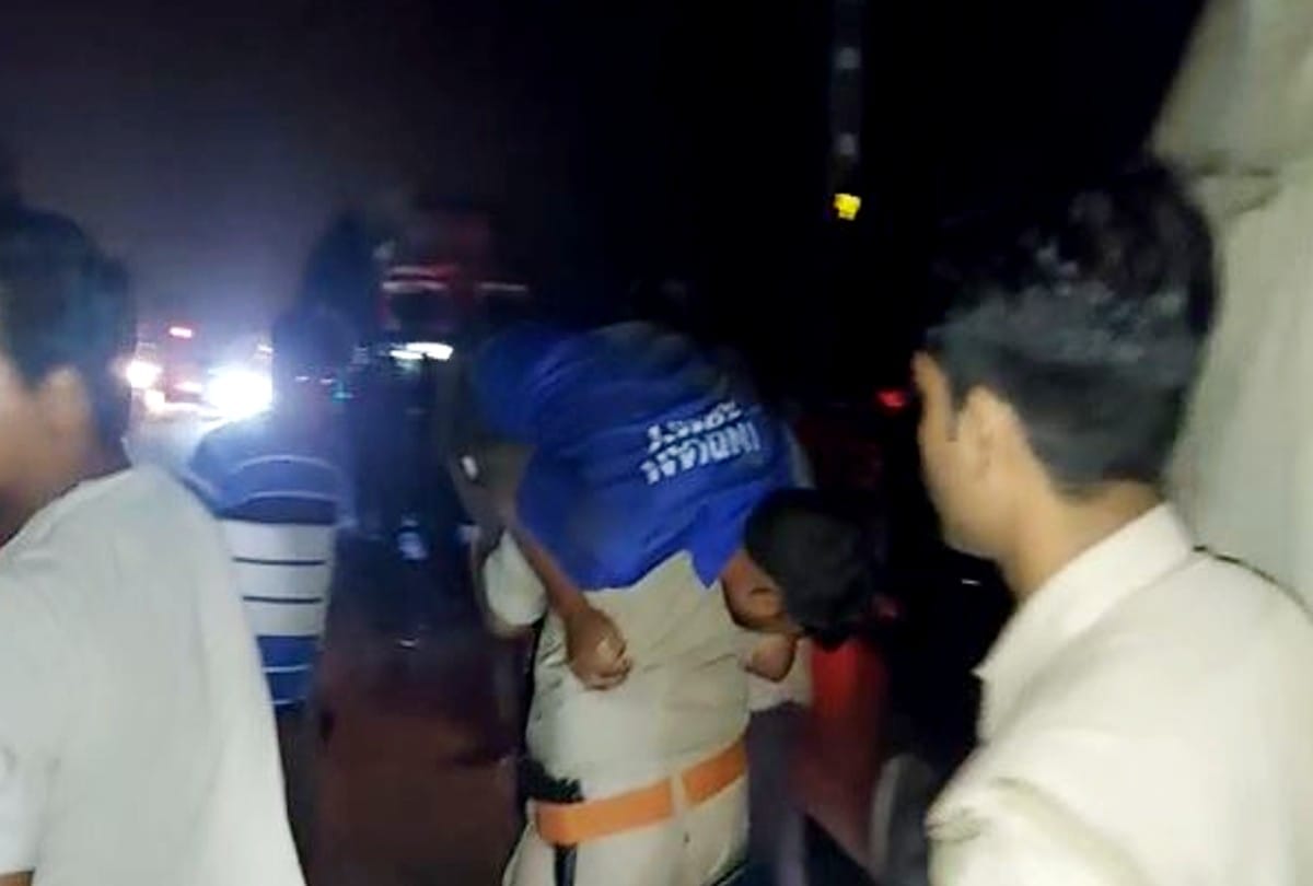 policeman running with carrying the injured man on his shoulder and saves his life
