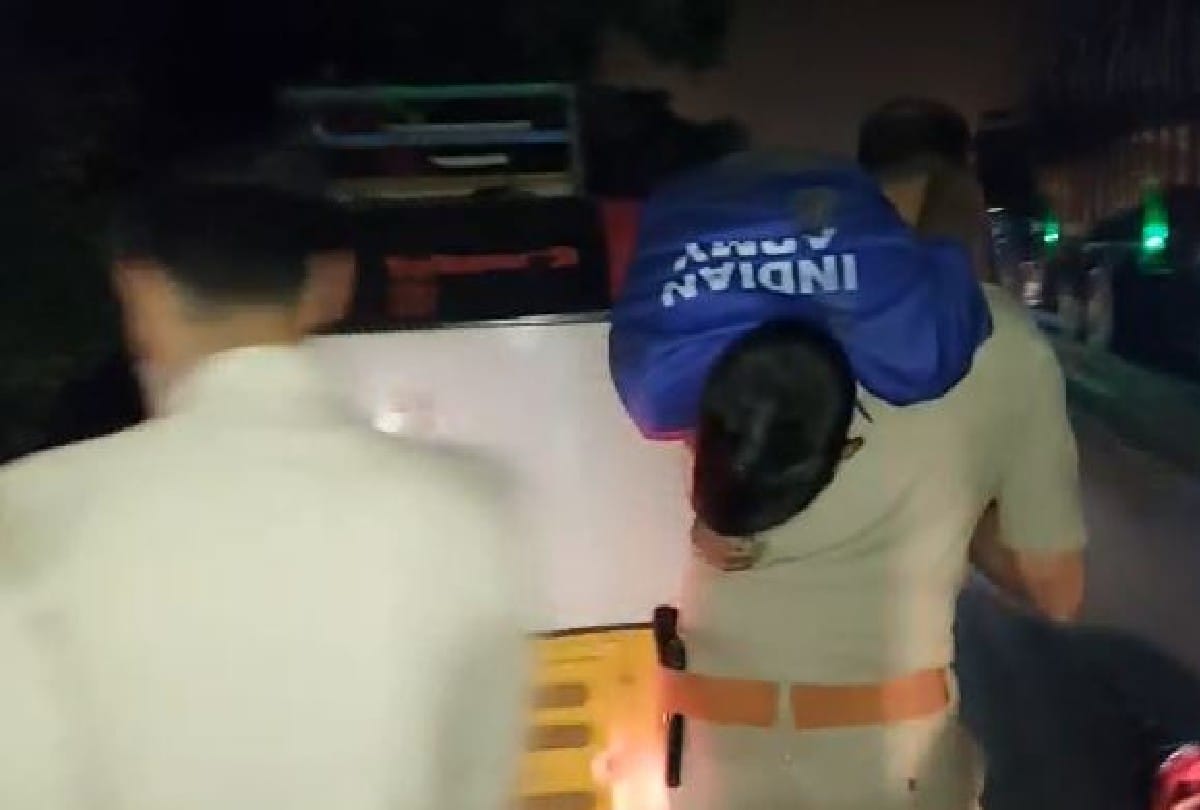 policeman running with carrying the injured man on his shoulder and saves his life